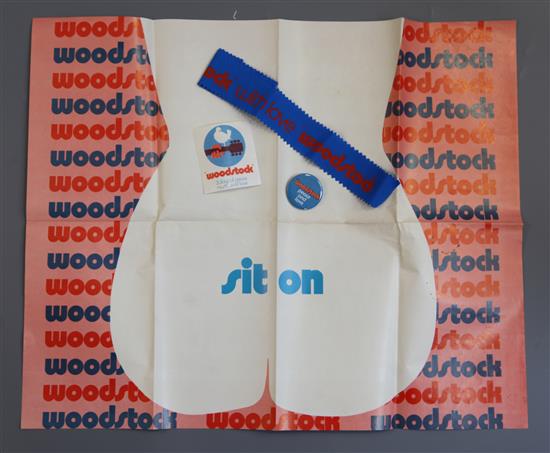 Woodstock - original 1969 hand out bag containing a ground sheet, badge, sticker and headband, in unused condition